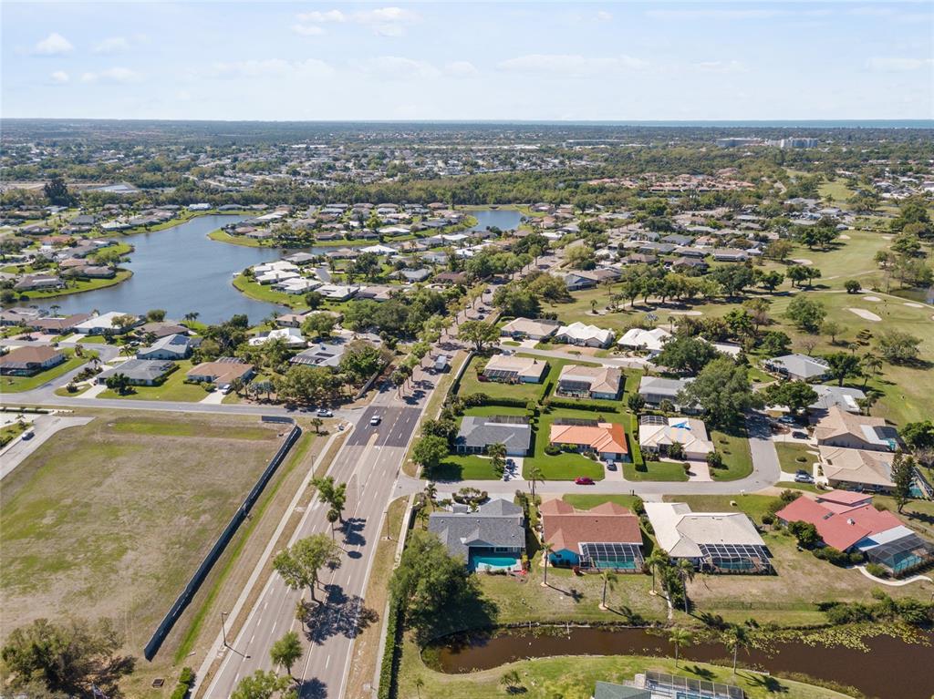 1009 Kings Court Venice, FL 34293 - Photo 24 of 25 an aerial view of residential houses with outdoor space