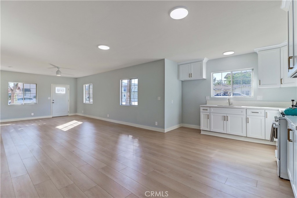 1101 Dawson Avenue Long Beach, CA 90804 - Photo 12 of 26 a view of a kitchen and window with wooden floor