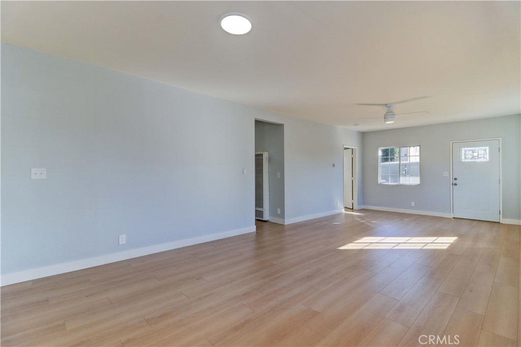 1101 Dawson Avenue Long Beach, CA 90804 - Photo 13 of 26 an empty room with wooden floor and windows