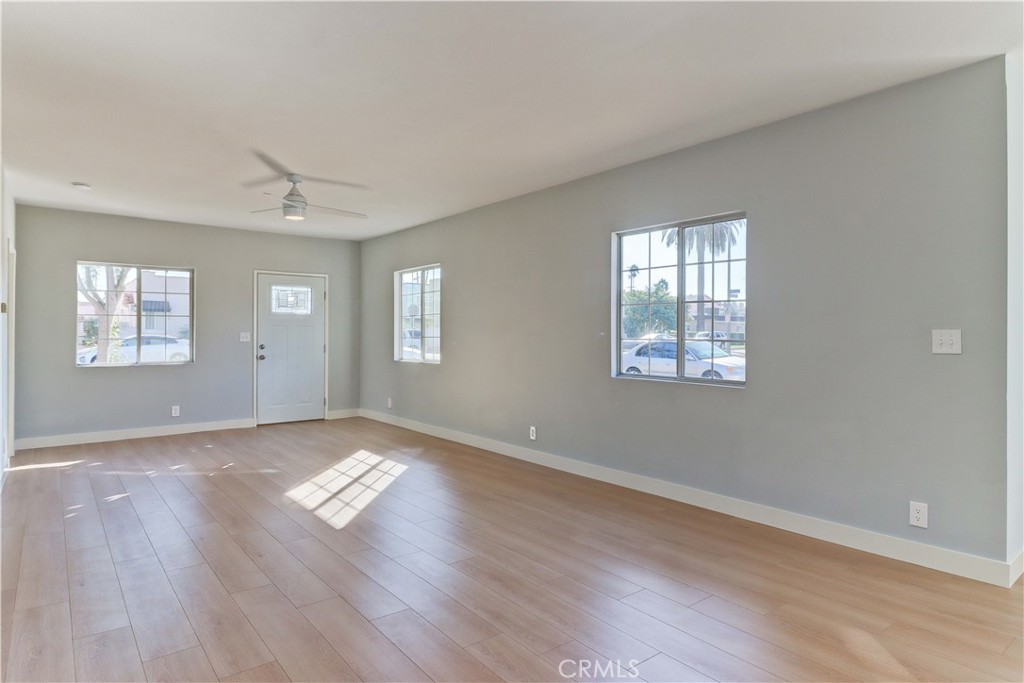 1101 Dawson Avenue Long Beach, CA 90804 - Photo 14 of 26 a view of an empty room with wooden floor and a window