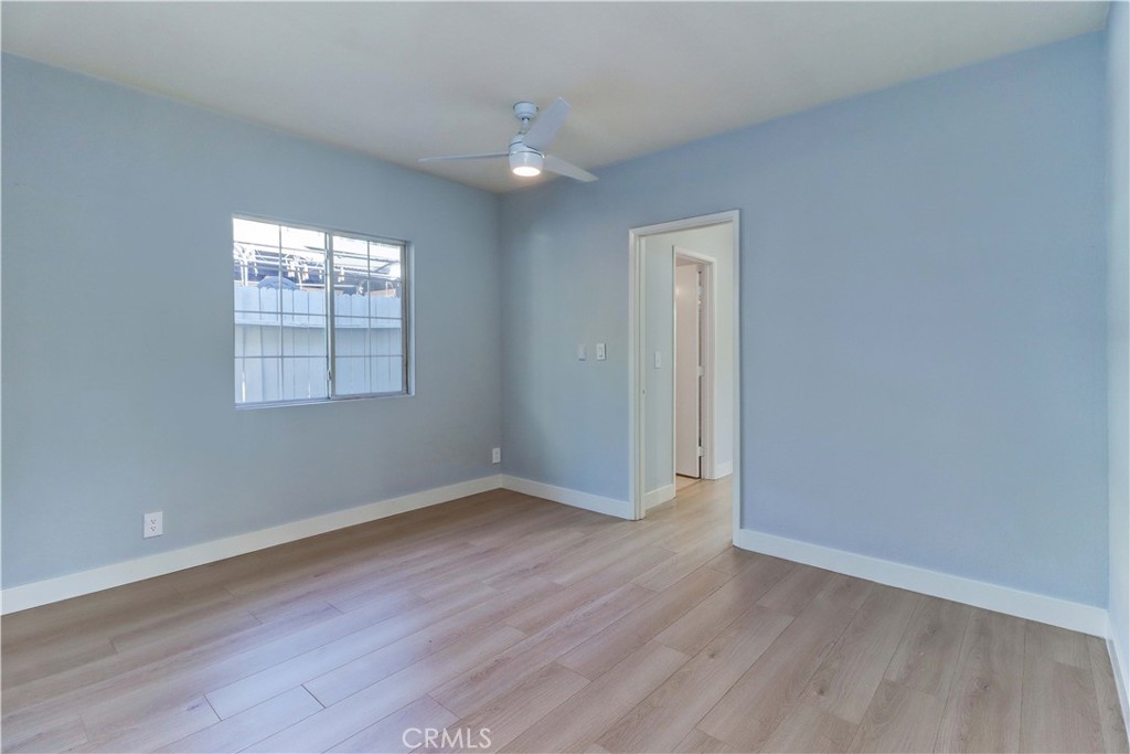 1101 Dawson Avenue Long Beach, CA 90804 - Photo 17 of 26 an empty room with wooden floor and windows