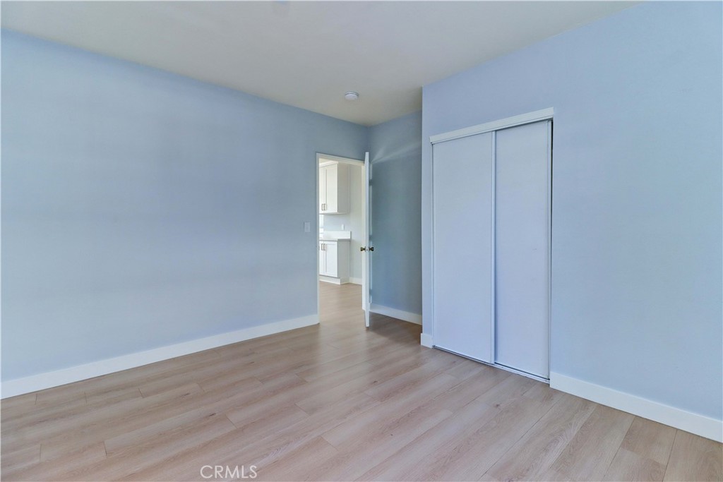 1101 Dawson Avenue Long Beach, CA 90804 - Photo 18 of 26 a view of an empty room with wooden floor and a window
