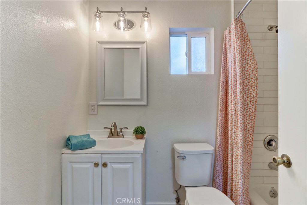 1101 Dawson Avenue Long Beach, CA 90804 - Photo 19 of 26 a bathroom with a sink a toilet and shower