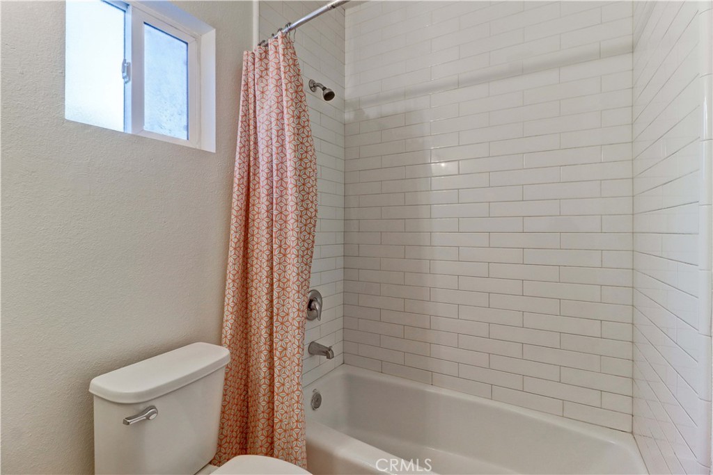 1101 Dawson Avenue Long Beach, CA 90804 - Photo 20 of 26 a bathroom with a toilet and shower