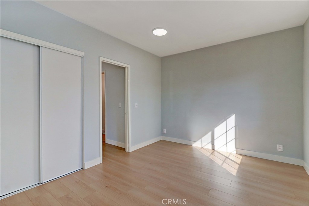 1101 Dawson Avenue Long Beach, CA 90804 - Photo 22 of 26 a view of an empty room with wooden floor and a window