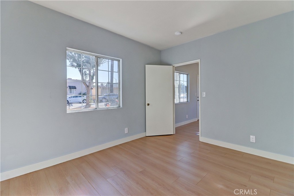 1101 Dawson Avenue Long Beach, CA 90804 - Photo 23 of 26 an empty room with wooden floor and windows