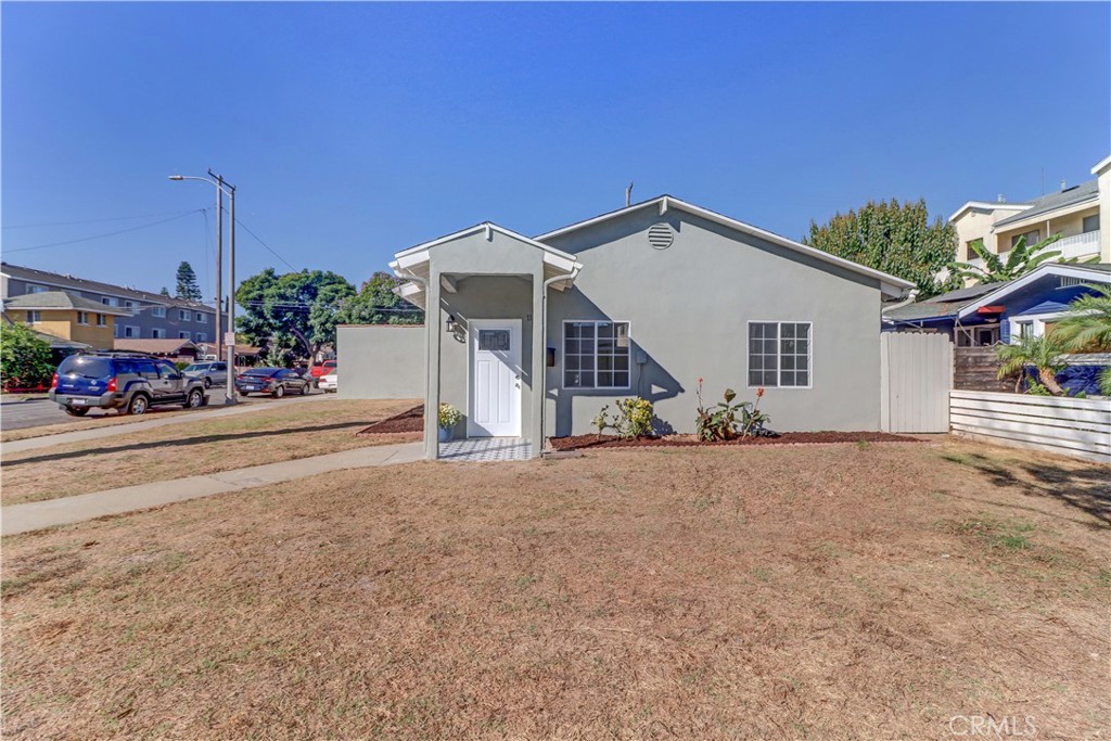 1101 Dawson Avenue Long Beach, CA 90804 - Photo 4 of 26 a view of a house with a yard and garage