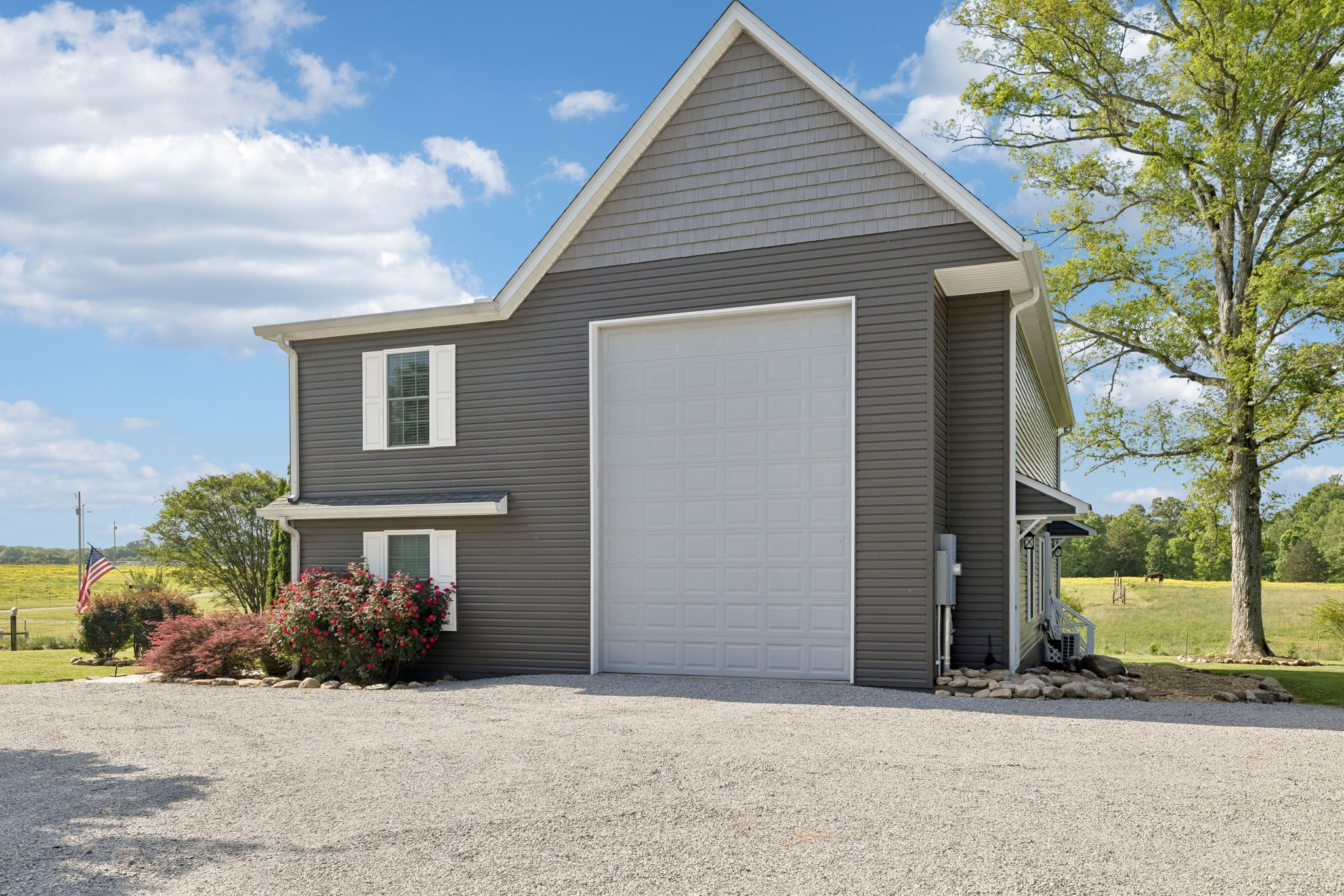 403 Bland Road Estill Springs, TN 37330 - Photo 35 of 66 a front view of a house with a yard and garage