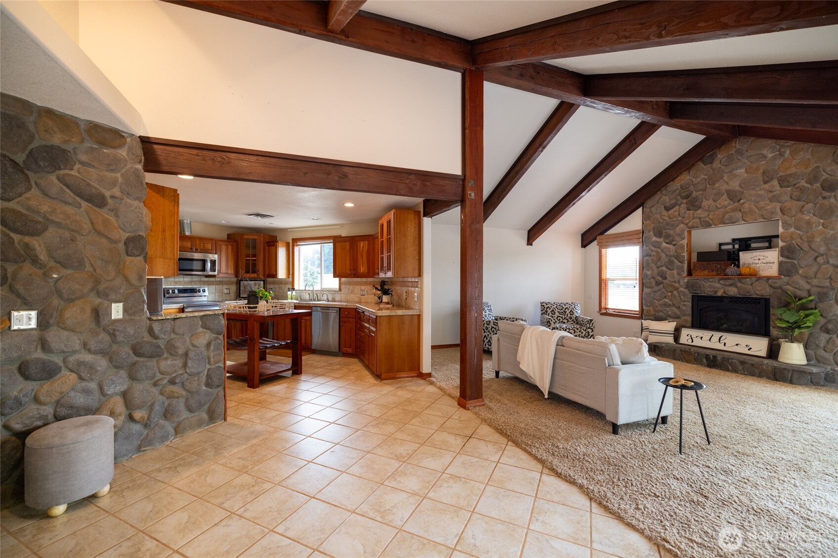 461 East Avery Road, Unit 35 Chehalis, WA 98532 - Photo 16 of 39 a living room with couches and a fireplace with a mirror
