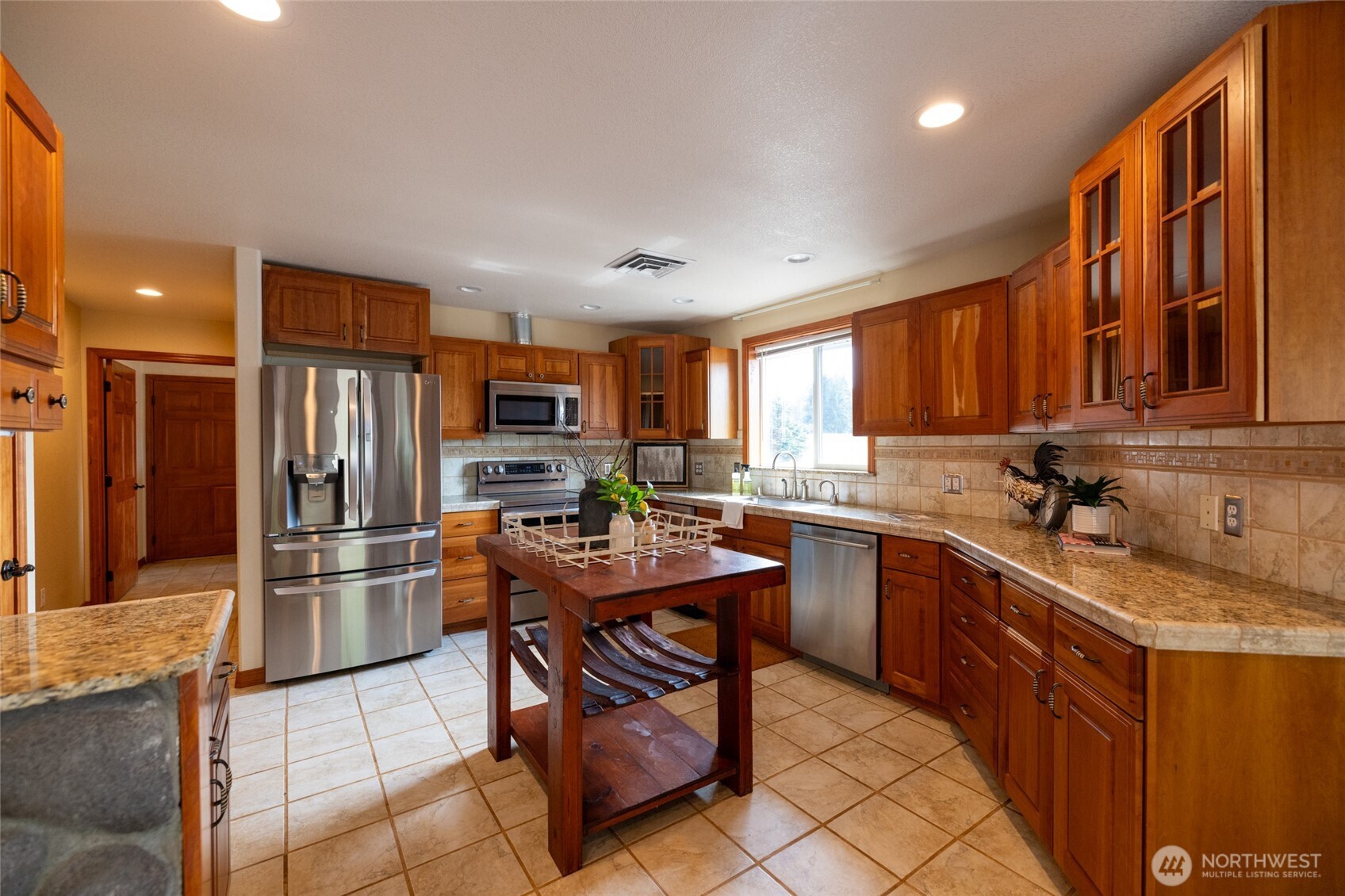 461 East Avery Road, Unit 35 Chehalis, WA 98532 - Photo 22 of 39 a kitchen with stainless steel appliances granite countertop a refrigerator stove top oven and a sink