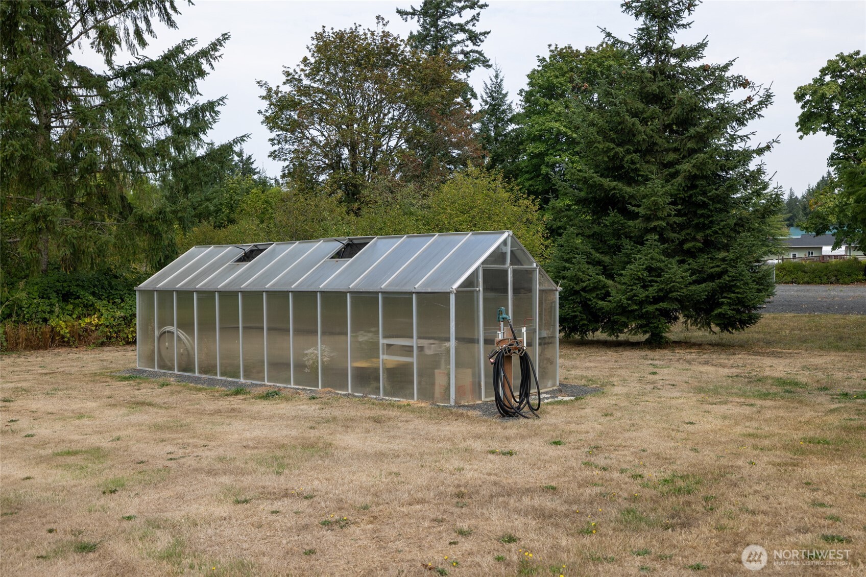 461 East Avery Road, Unit 35 Chehalis, WA 98532 - Photo 38 of 39 a view of a house with a garden