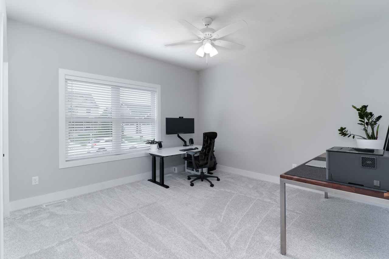 1708 Flagstone Drive Normal, IL 61761 - Photo 24 of 34 a view of a workspace with furniture and a window