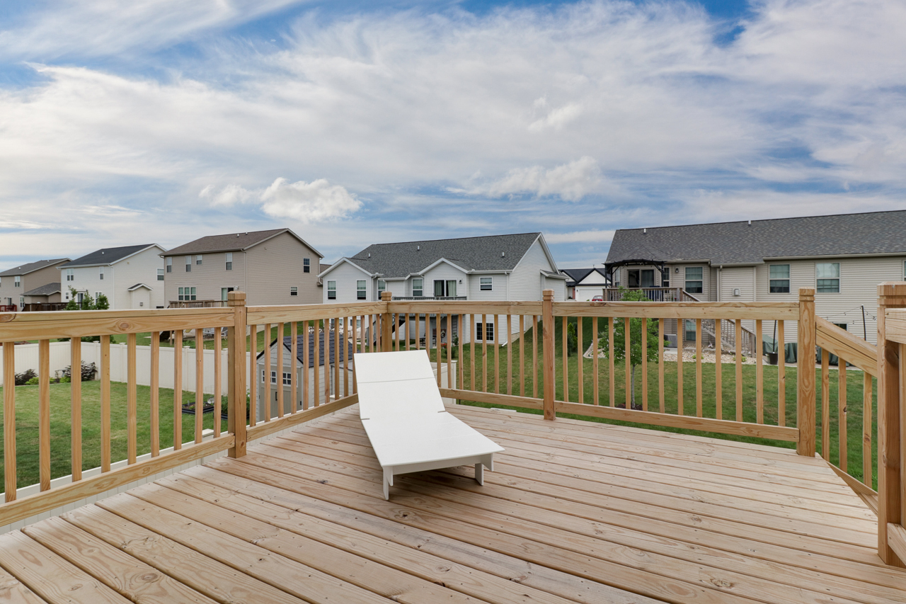 1708 Flagstone Drive Normal, IL 61761 - Photo 29 of 34 a view of a balcony with wooden floor and city view