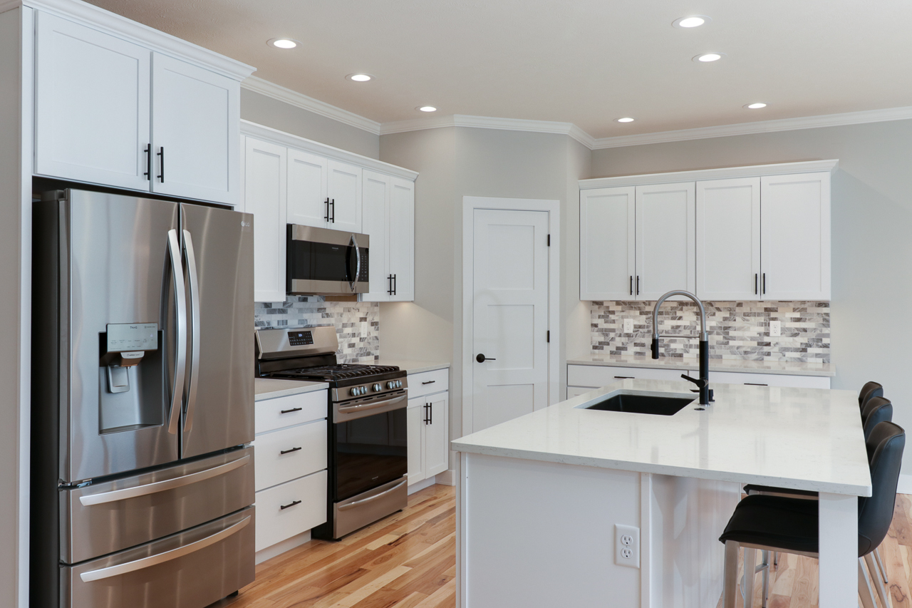 1708 Flagstone Drive Normal, IL 61761 - Photo 3 of 34 a kitchen with stainless steel appliances a refrigerator stove and microwave