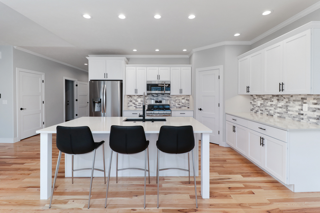 1708 Flagstone Drive Normal, IL 61761 - Photo 4 of 34 a kitchen with stainless steel appliances kitchen island granite countertop a refrigerator and cabinets