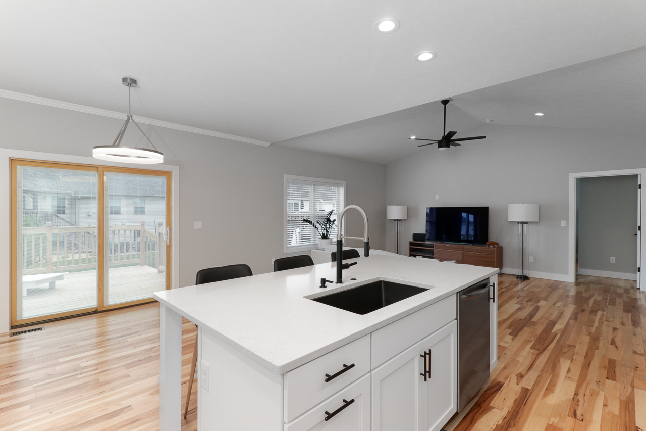 1708 Flagstone Drive Normal, IL 61761 - Photo 7 of 34 a kitchen with kitchen island a sink appliances and wooden floor