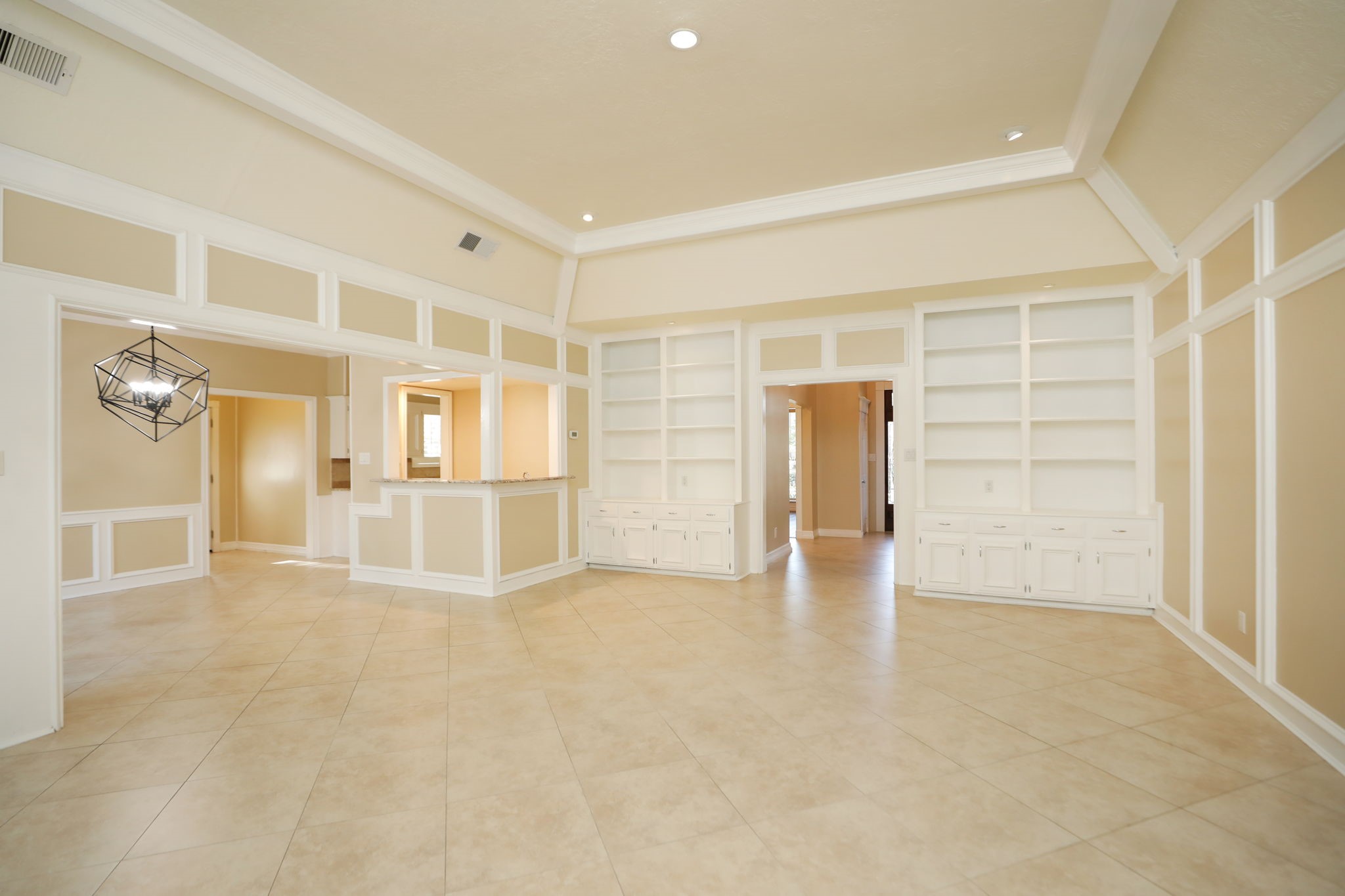 9311 Windrush Drive Spring, TX 77379 - Photo 12 of 50 Stunning family room looking toward the front of the house. There is a wet bar in the middle, storage and more custom built-ins.