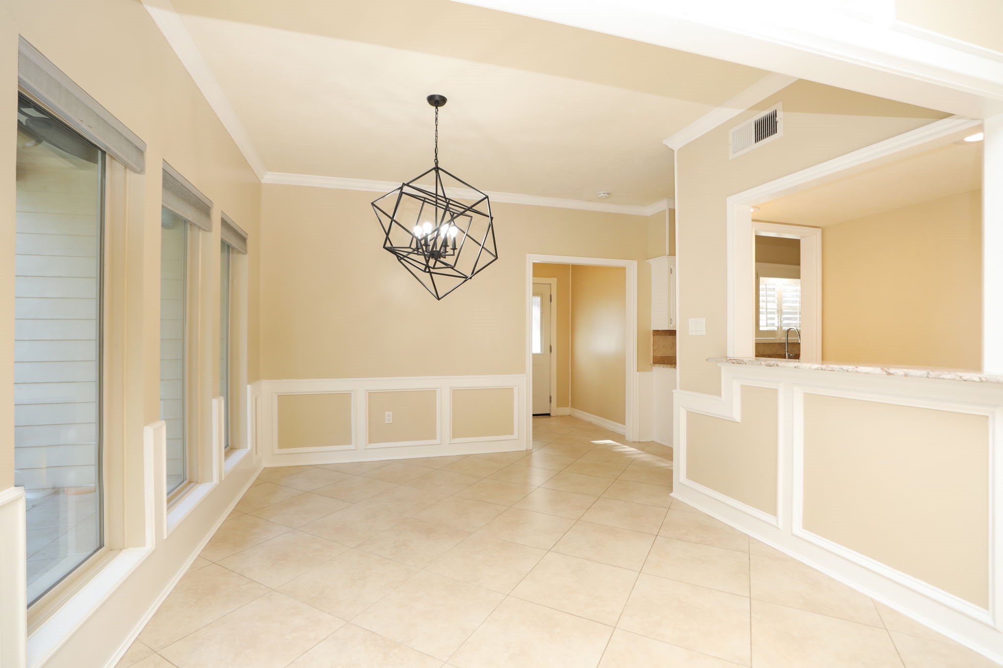 9311 Windrush Drive Spring, TX 77379 - Photo 15 of 50 Huge breakfast room with designer fixture and windows to the expansive, private back yard oasis!