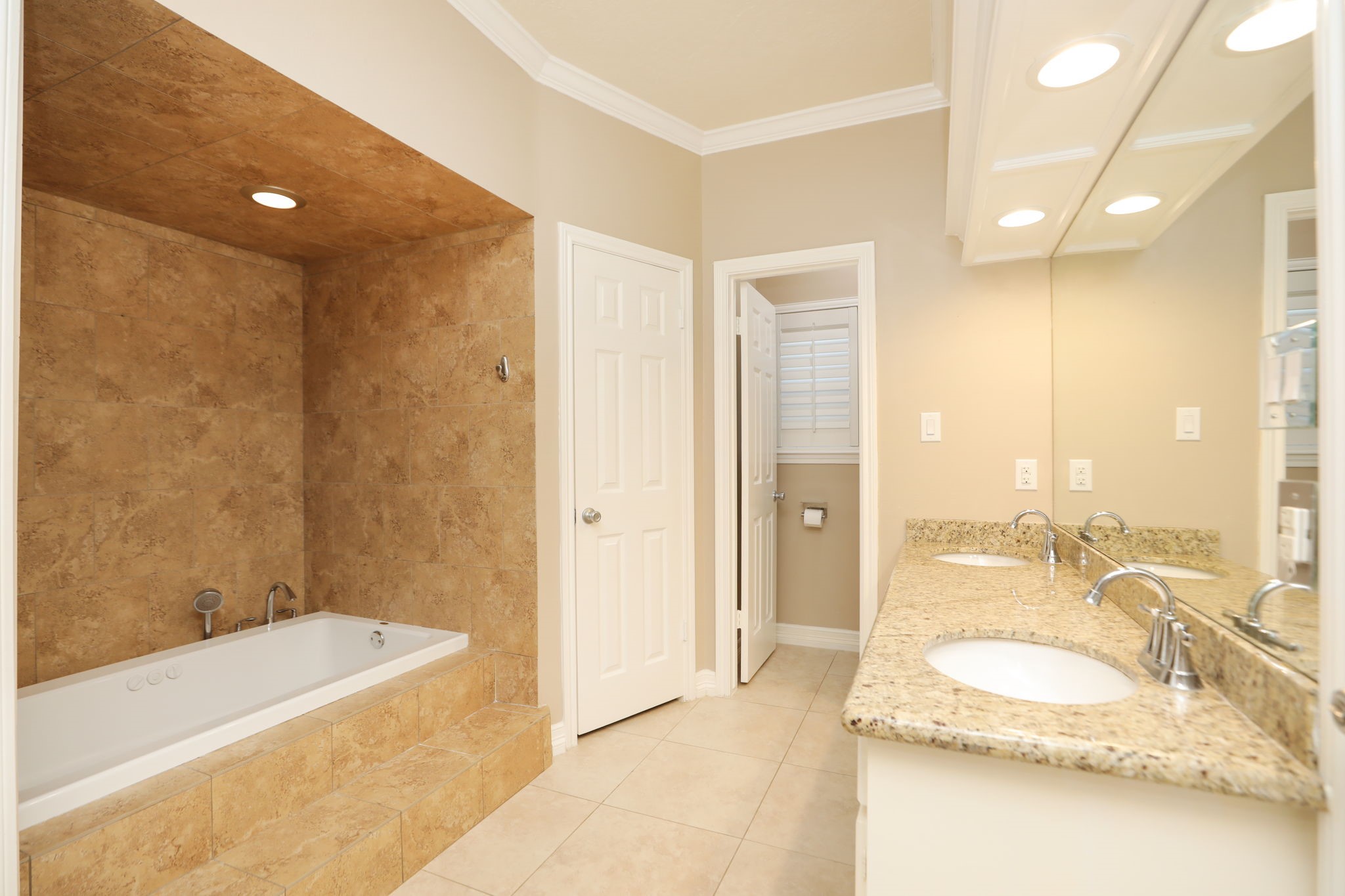 9311 Windrush Drive Spring, TX 77379 - Photo 24 of 50 Luxurious primary bathroom with jetted tub, double sinks with granite vanity, 2 large walk-in closets and separate shower.