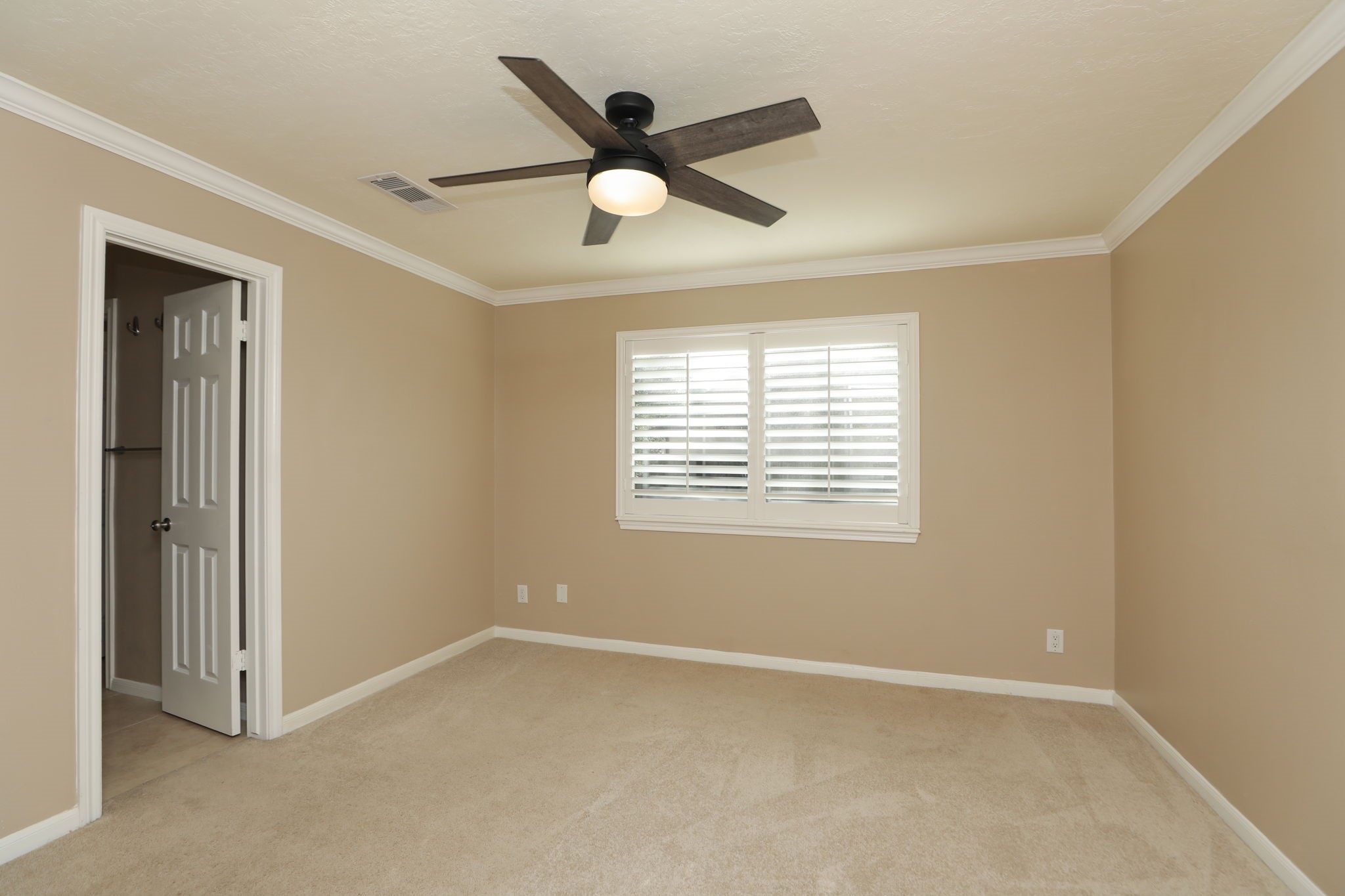 9311 Windrush Drive Spring, TX 77379 - Photo 31 of 50 Bedroom # 3 with fan, crown molding and plantation shutters.