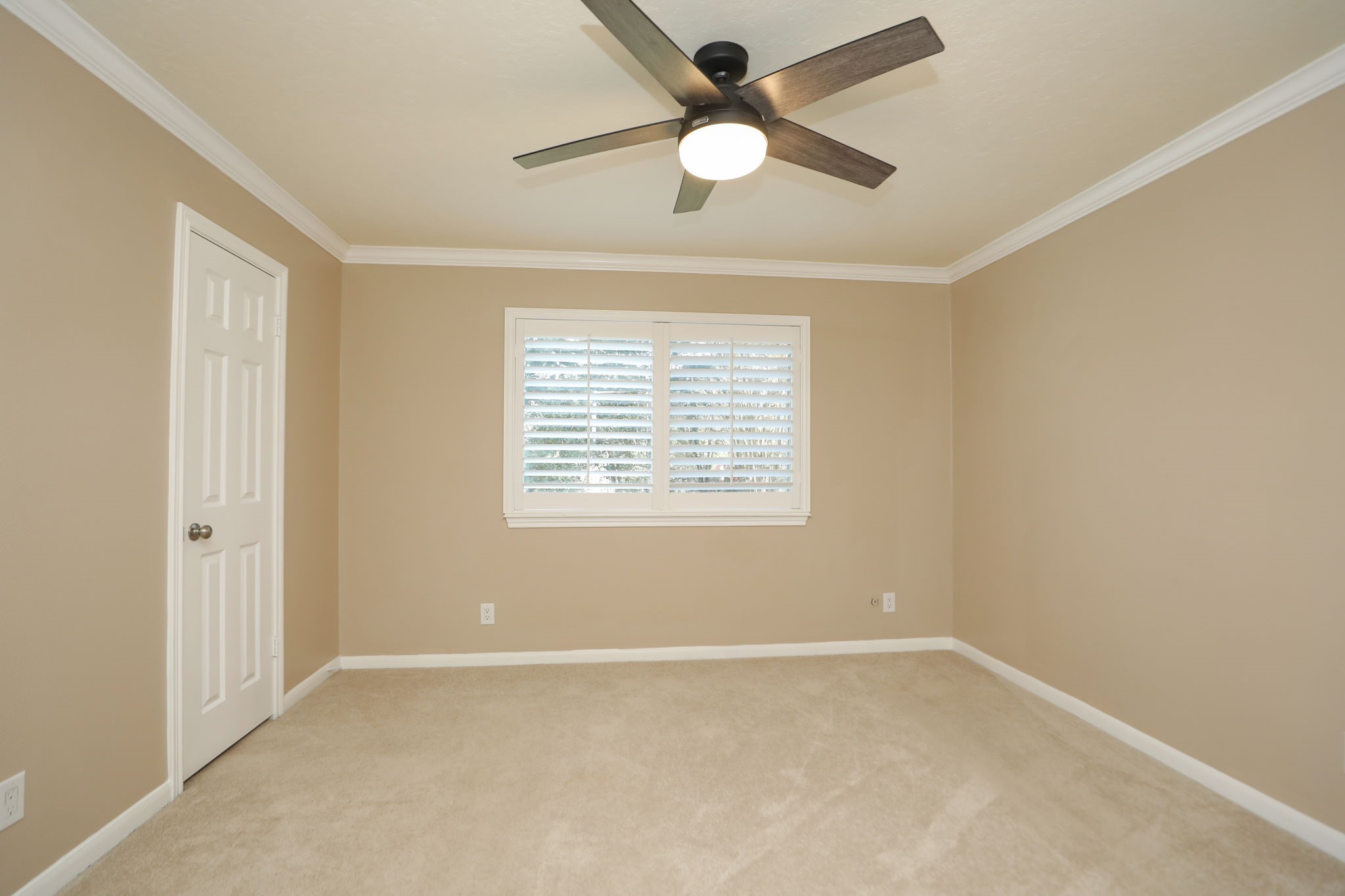 9311 Windrush Drive Spring, TX 77379 - Photo 33 of 50 Bedroom # with fan, molding and shutters as well!