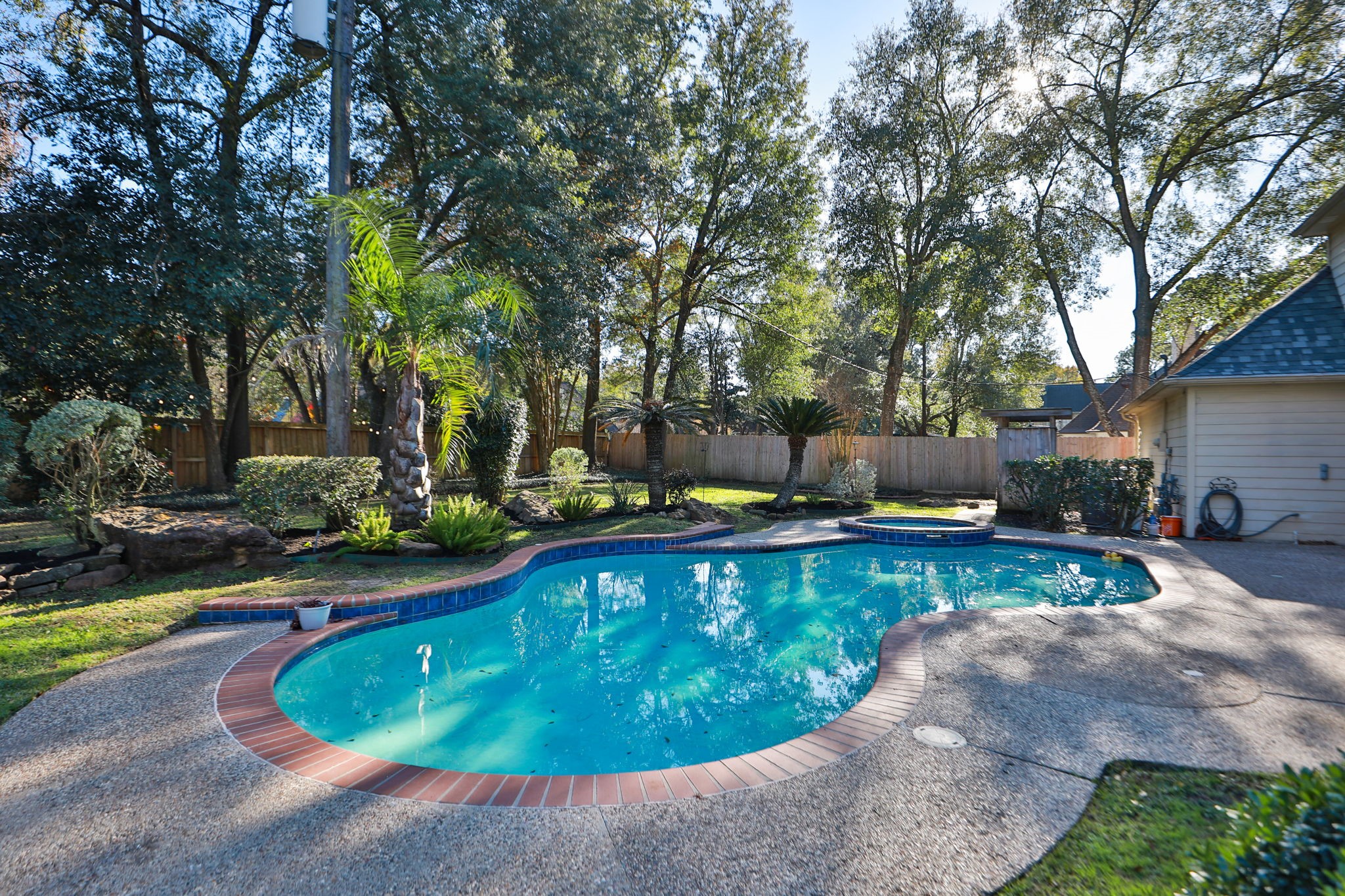 9311 Windrush Drive Spring, TX 77379 - Photo 36 of 50 Private gunite pool with spa and lush landscaping.