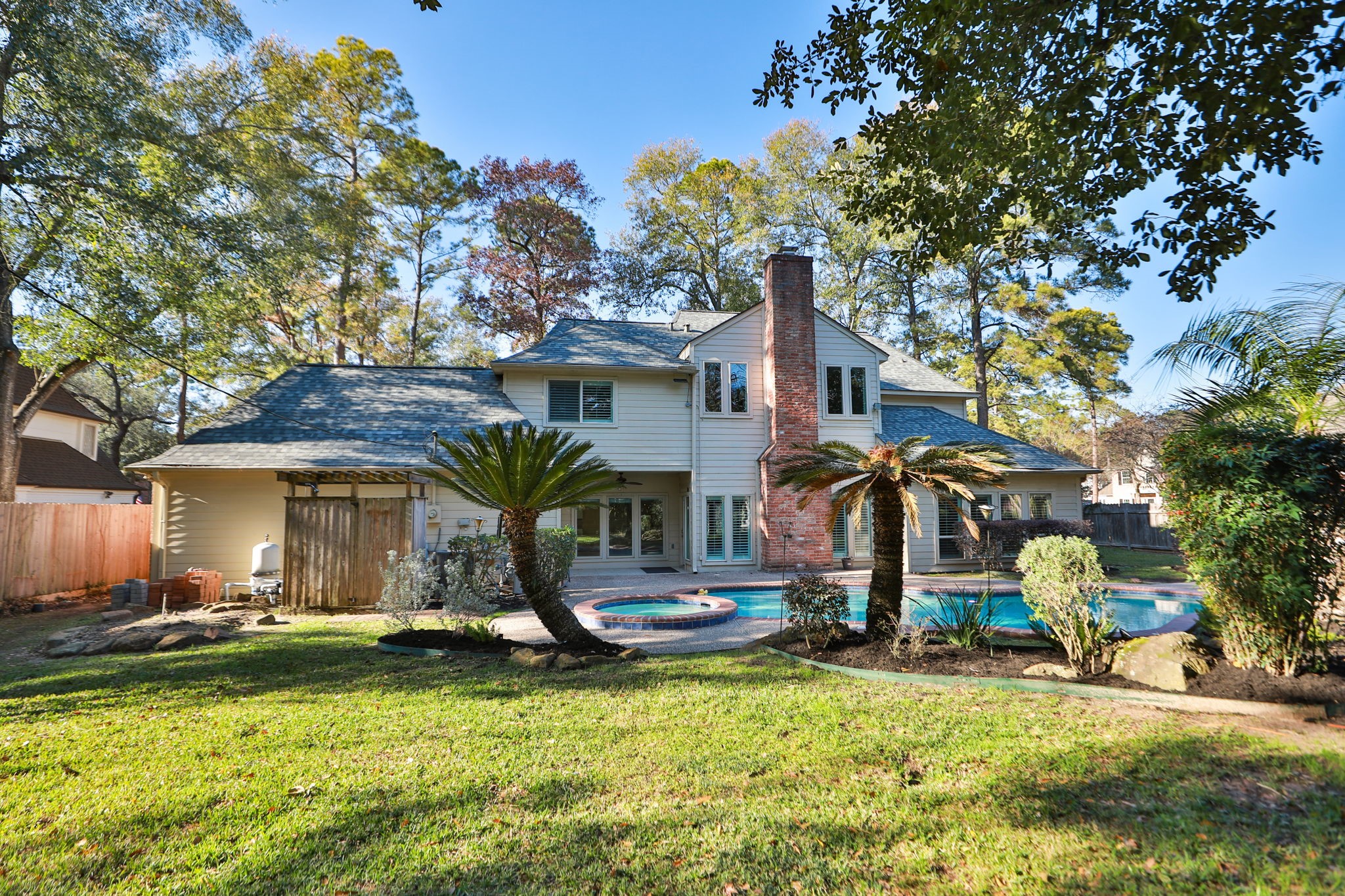 9311 Windrush Drive Spring, TX 77379 - Photo 39 of 50 There is an outdoor shower and newer fence on the left side.