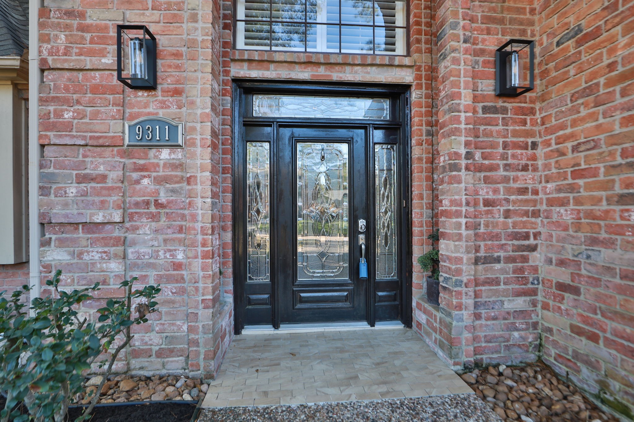 9311 Windrush Drive Spring, TX 77379 - Photo 6 of 50 Custom front door with transom. window and beveled glass sidelites.