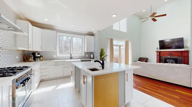 a kitchen with a stove a sink and a refrigerator
