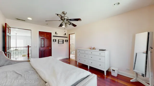 a bed room with a bed and a mirror