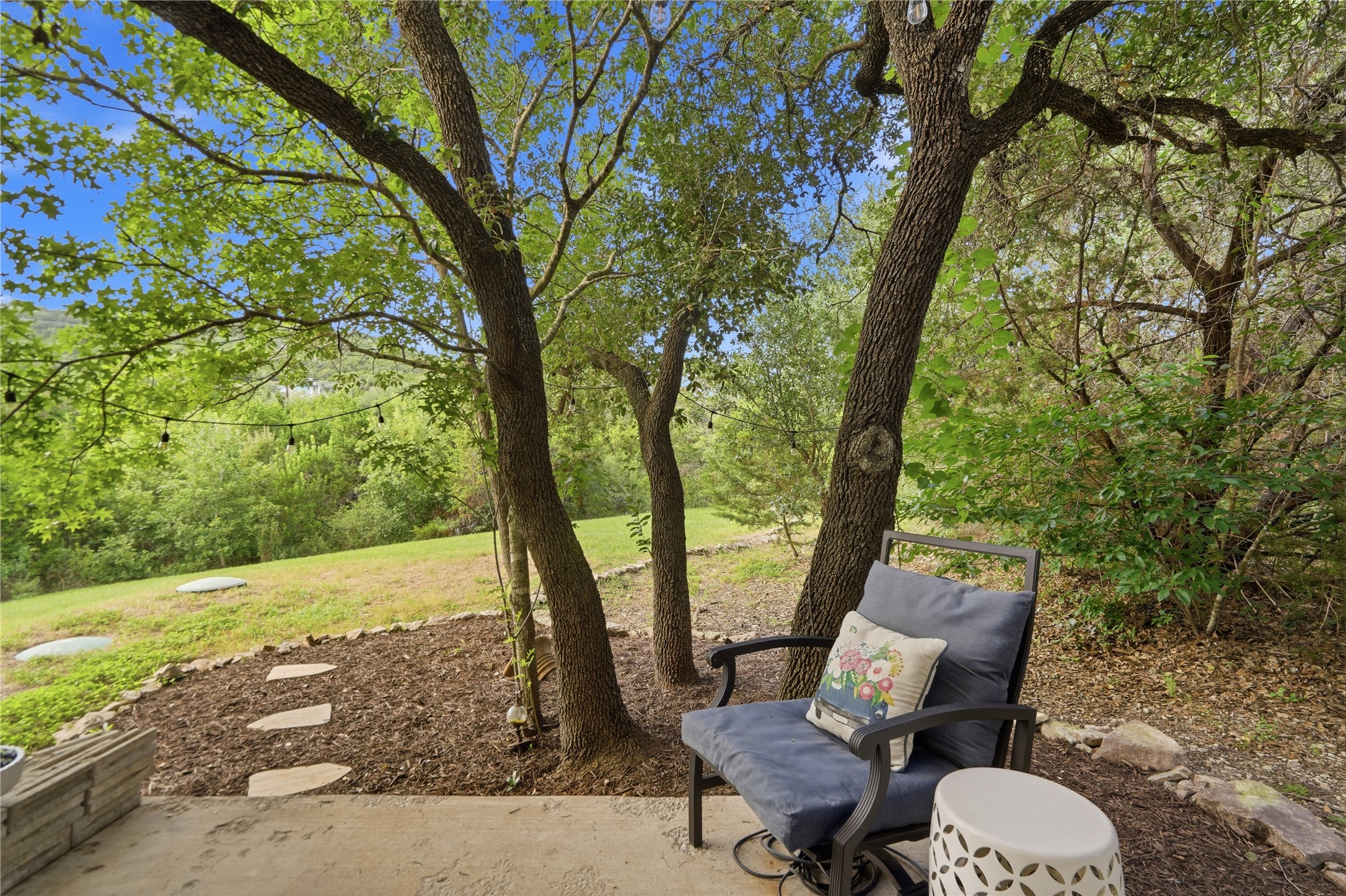 18406 Roundrock Road Jonestown, TX 78645 - Photo 26 of 33 a view of a chairs and table in the garden
