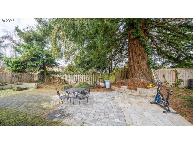 32907 Southwest Acacia Court, Unit 68 Cornelius, OR 97113 - Photo 14 of 15 a backyard of a house with table and chairs