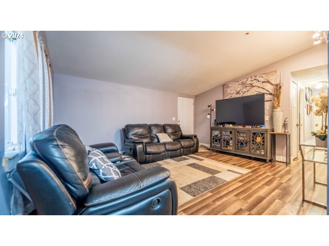 32907 Southwest Acacia Court, Unit 68 Cornelius, OR 97113 - Photo 6 of 15 a living room with furniture and a flat screen tv