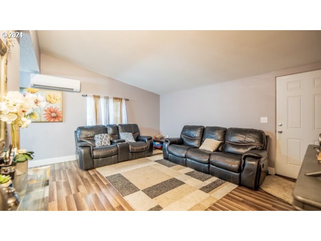 32907 Southwest Acacia Court, Unit 68 Cornelius, OR 97113 - Photo 7 of 15 a living room with furniture and a rug