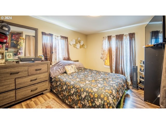 32907 Southwest Acacia Court, Unit 68 Cornelius, OR 97113 - Photo 10 of 15 a room with a bed window and a mirror