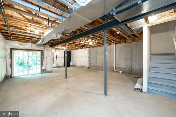 a view of an empty room with windows