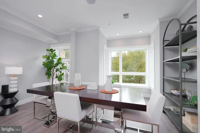 a bathroom with a granite countertop sink a toilet a mirror and shower