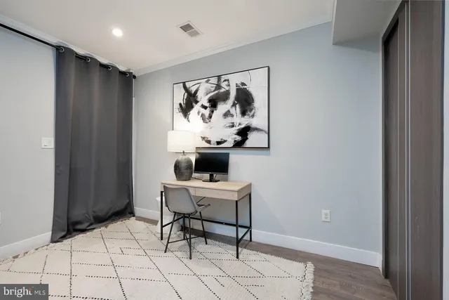 a bathroom with a bathtub a sink a toilet and a mirror