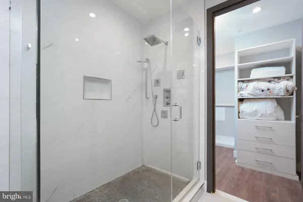 a bedroom with a bed and a walk in closet