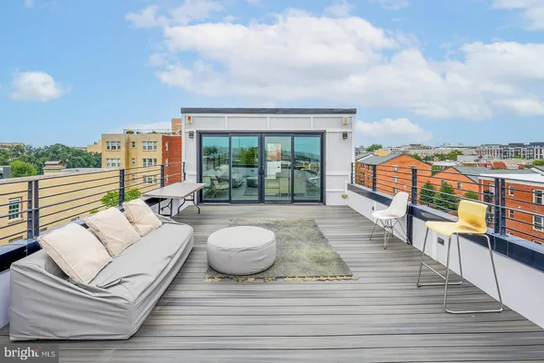 a kitchen with stainless steel appliances a stove microwave and refrigerator