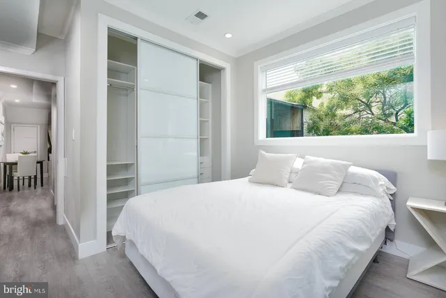 a bathroom with a double vanity sink and mirror