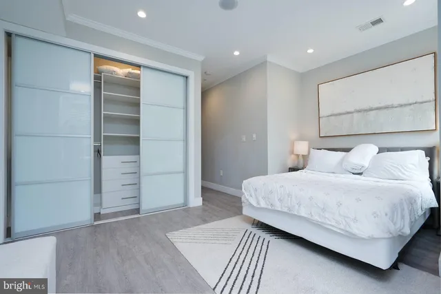a kitchen with stainless steel appliances a sink and a refrigerator