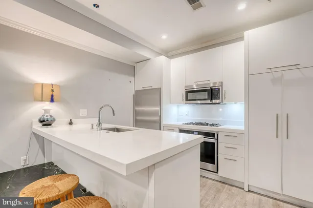 a bedroom with a bed and a lamp