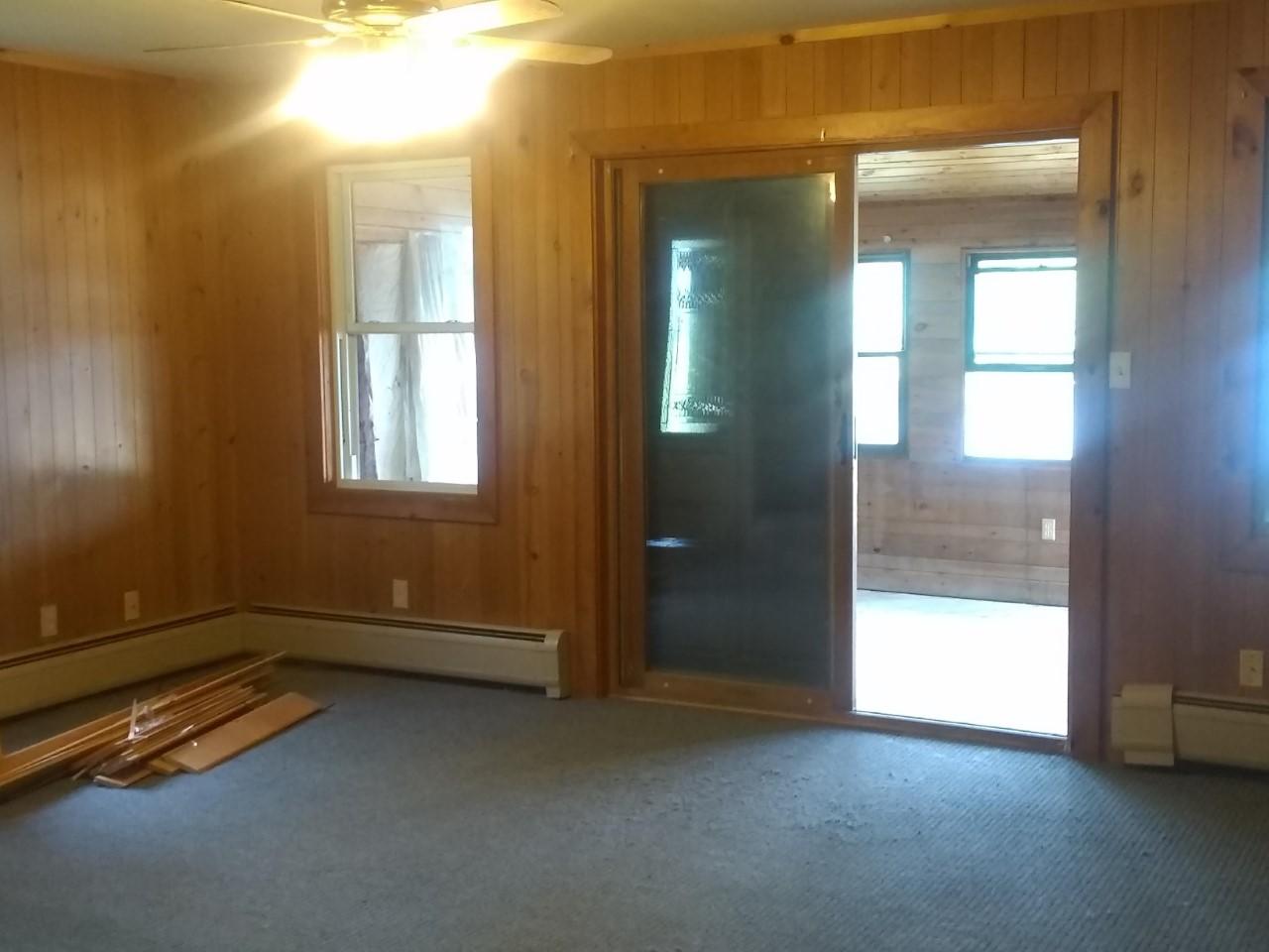 851 Federal Road Livermore, ME 04253 - Photo 30 of 47 0336 blue living room out to enclosed ro