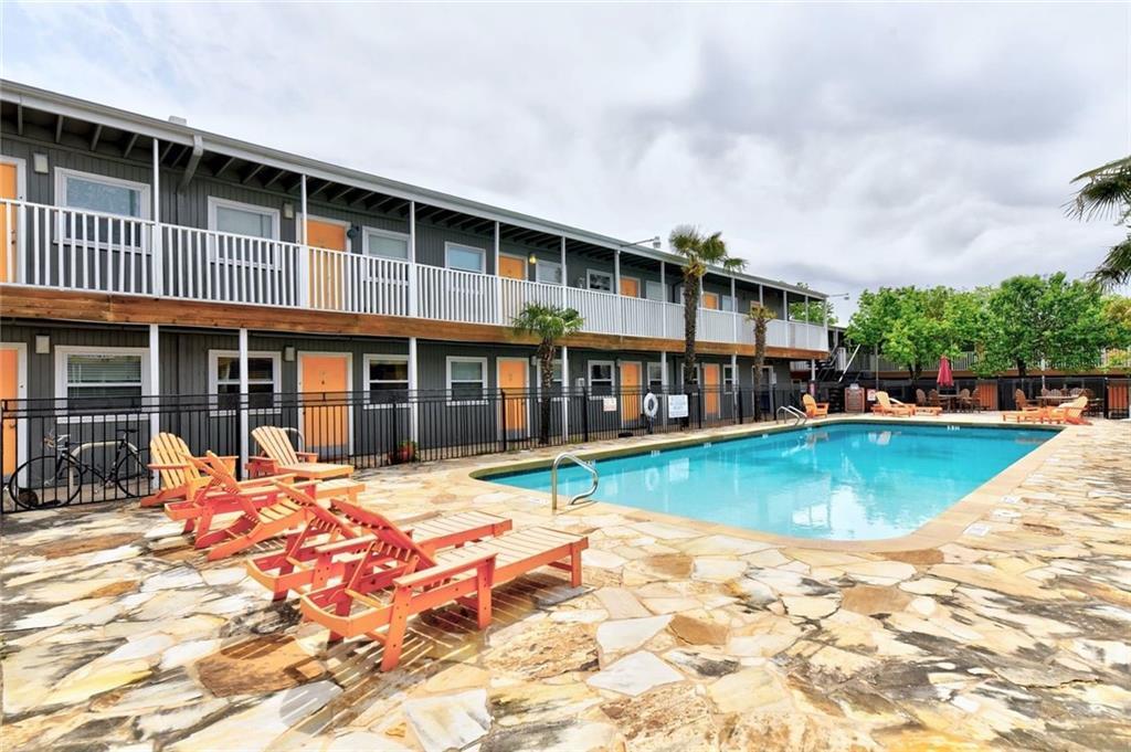 2401 Manor Road, Unit 102 Austin, TX 78722 - Photo 5 of 22 Community pool featuring a patio area