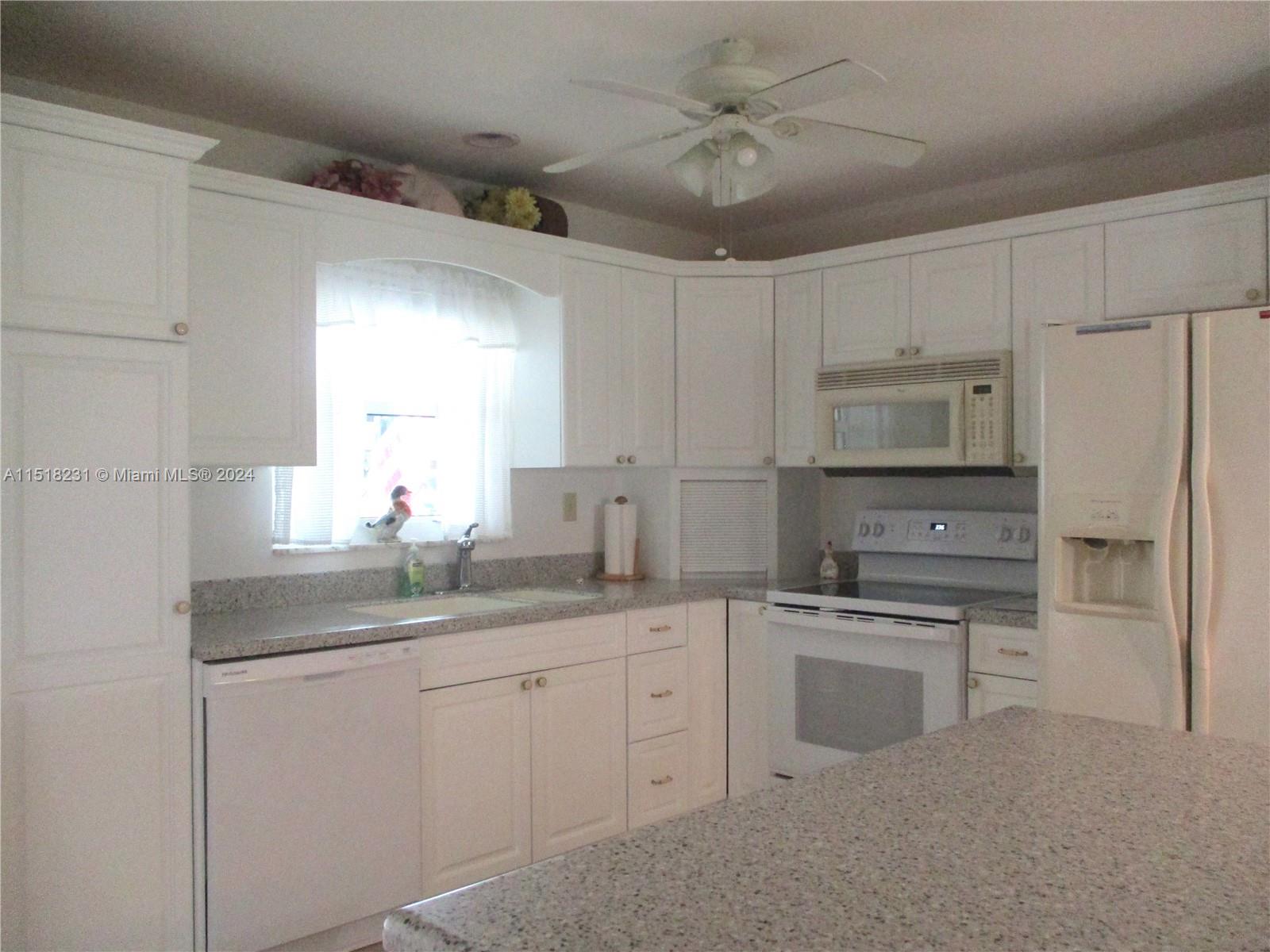 6531 Southeast Federal Highway, Unit R109 Stuart, FL 34997 - Photo 3 of 26 WHITE CABINETS