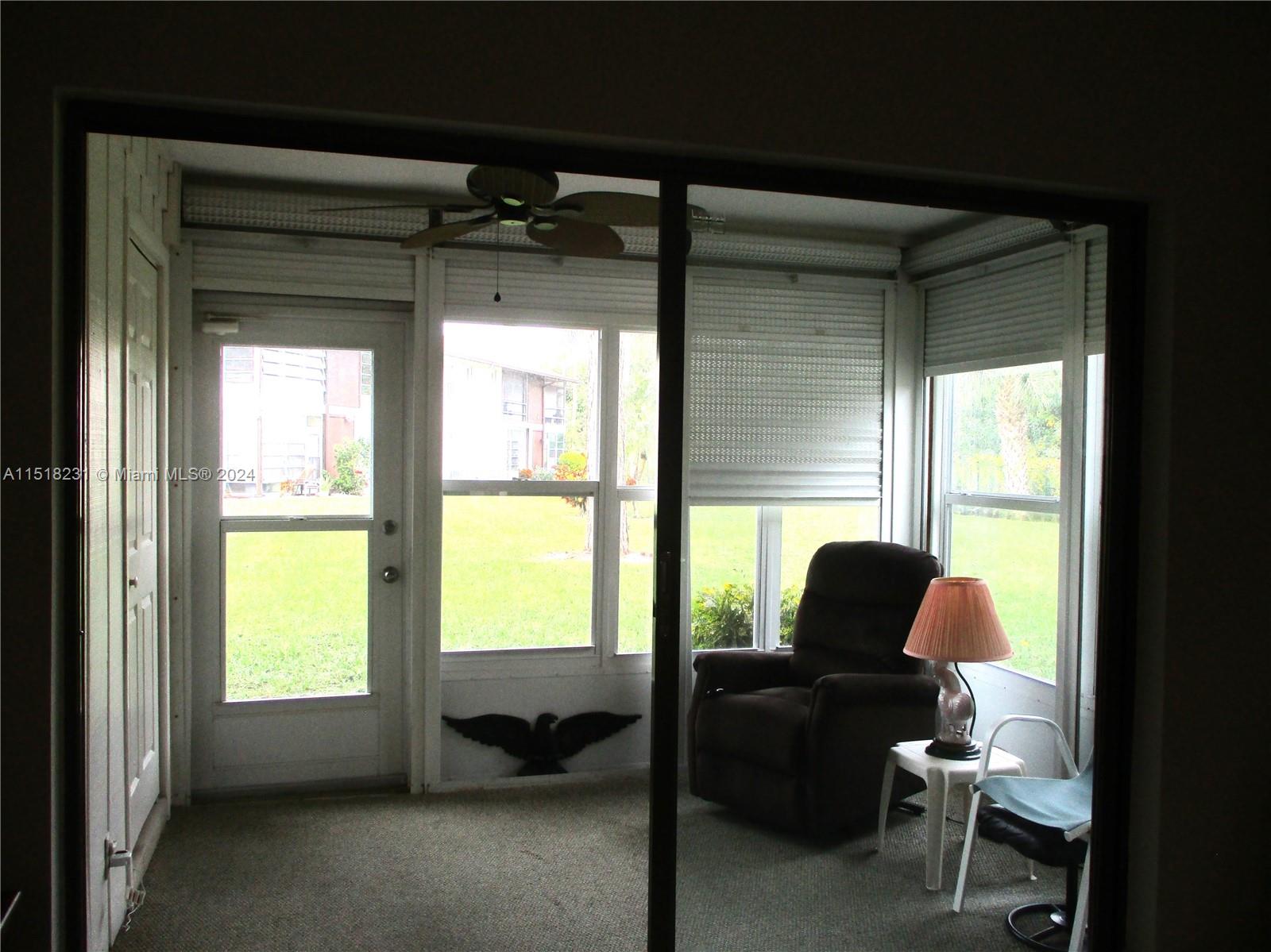 6531 Southeast Federal Highway, Unit R109 Stuart, FL 34997 - Photo 7 of 26 ENCLOSED PATIO WITH WASHER/DRYER IN STORAGE AREA ON LEFT. ROLL DOWN SHUTTERS FOR YOUR PRIVACY