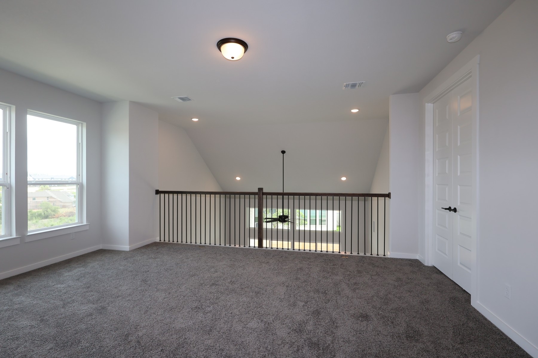 436 Leaning Rock Road Georgetown, TX 78628 - Photo 14 of 22 an empty room with stairs and windows
