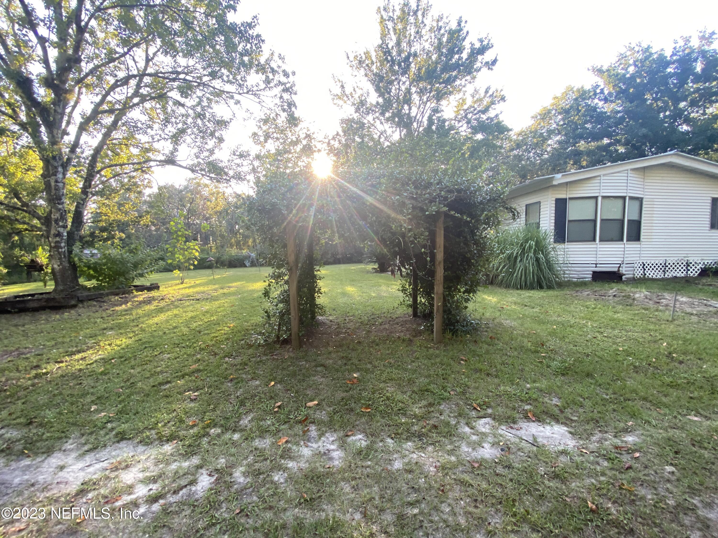 3966 Michaelwood Road Middleburg, FL 32068 - Photo 14 of 17 a view of a house with a yard