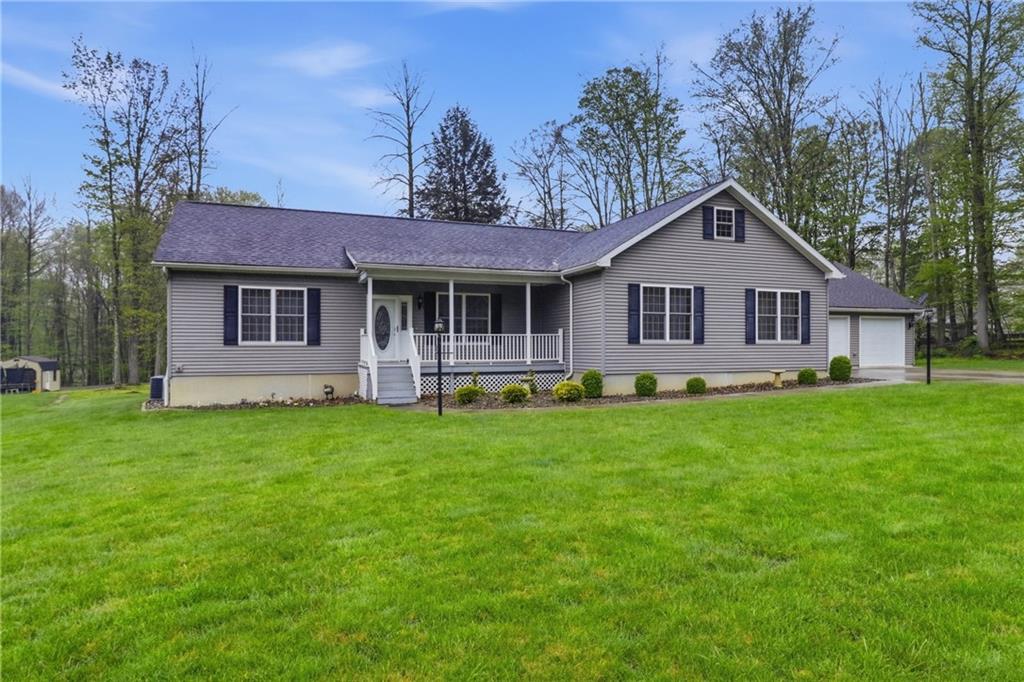 a view of a house with a backyard